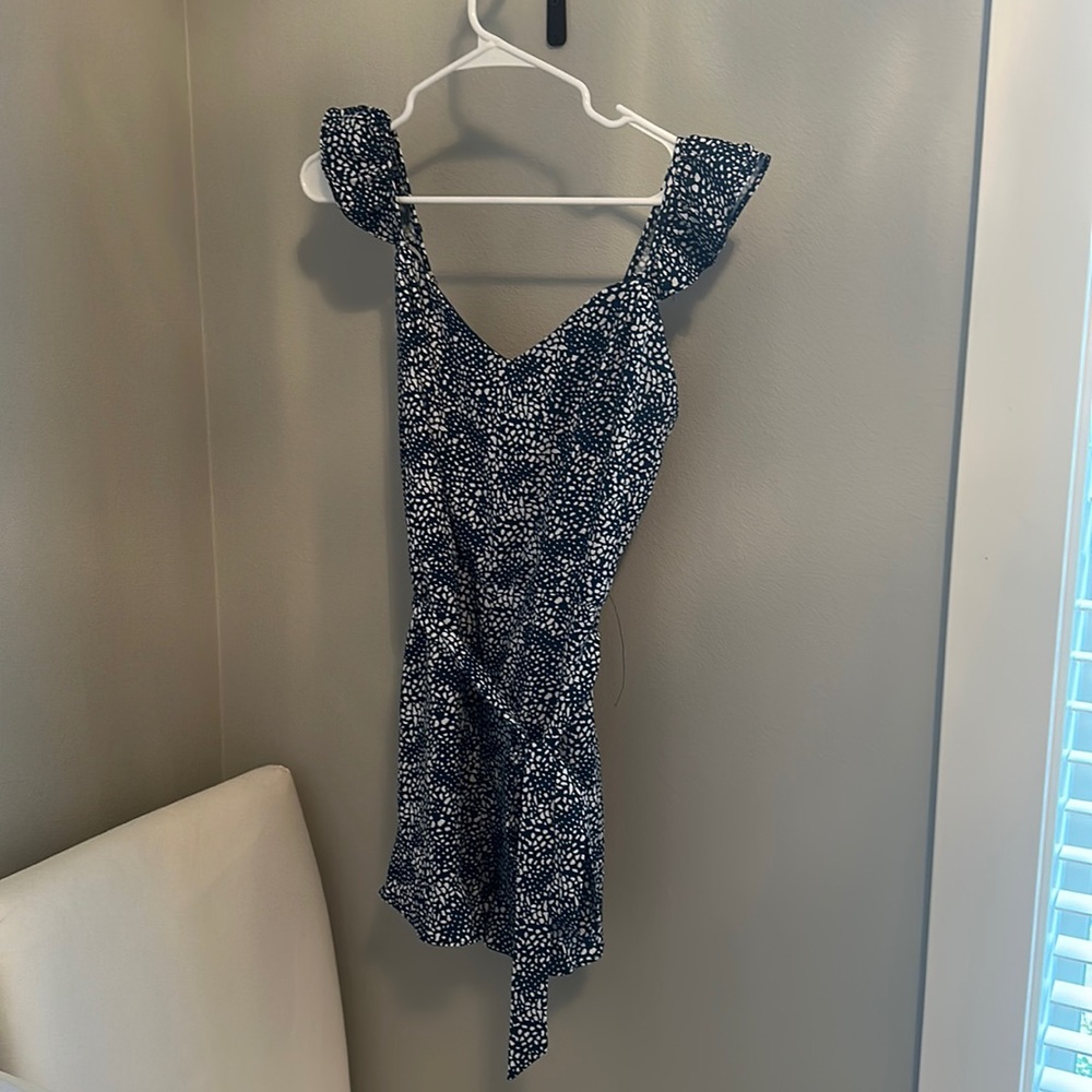 Blue romper with white print and tie waist